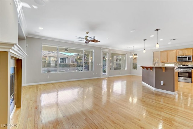 unfurnished living room featuring crown molding, light wood-type flooring, and ceiling fan