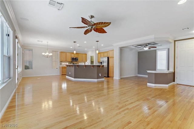 unfurnished living room with crown molding, light wood-type flooring, and ceiling fan with notable chandelier