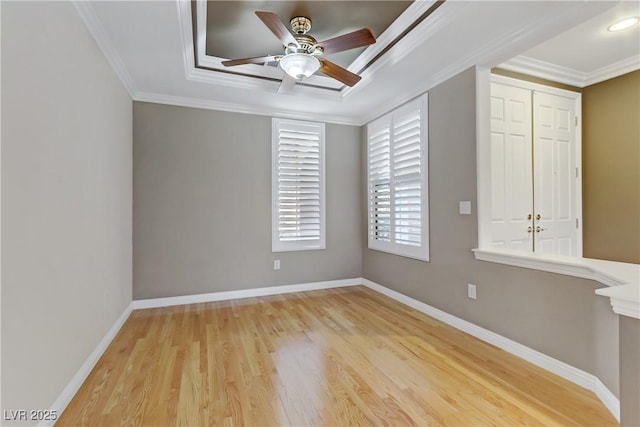 unfurnished room featuring ceiling fan, light hardwood / wood-style flooring, and ornamental molding