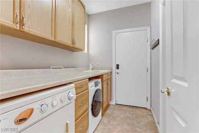 laundry area with sink, cabinets, and light tile patterned flooring