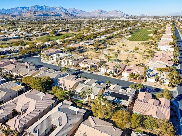 birds eye view of property with a mountain view