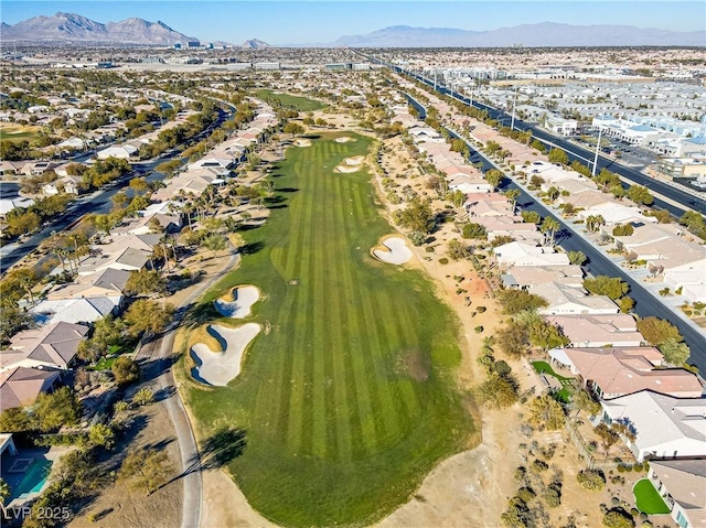 birds eye view of property with a mountain view