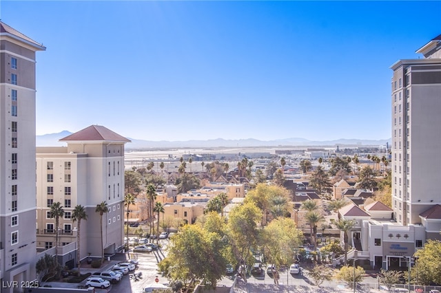 property's view of city with a mountain view