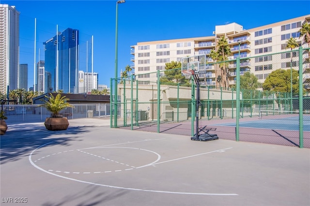 view of basketball court featuring tennis court