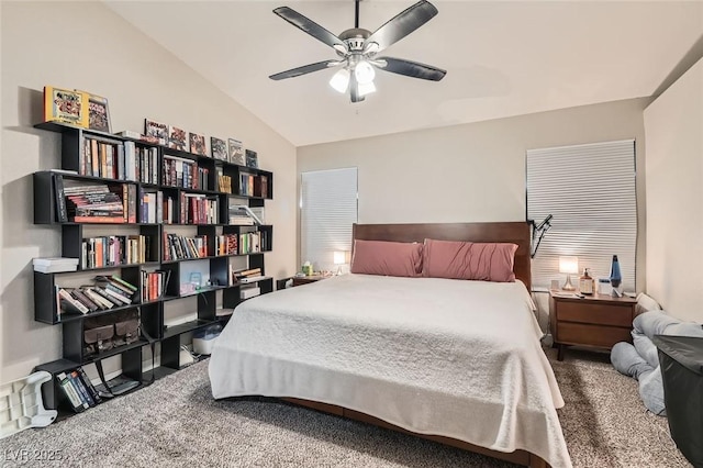 bedroom featuring carpet floors, vaulted ceiling, and ceiling fan