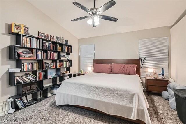 carpeted bedroom with vaulted ceiling and ceiling fan