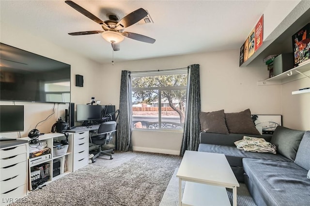 carpeted home office with ceiling fan