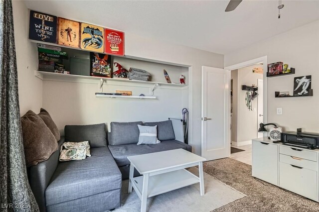 living area featuring ceiling fan