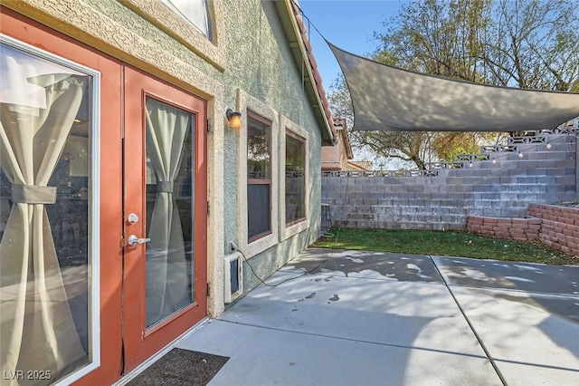 view of side of property featuring a patio area