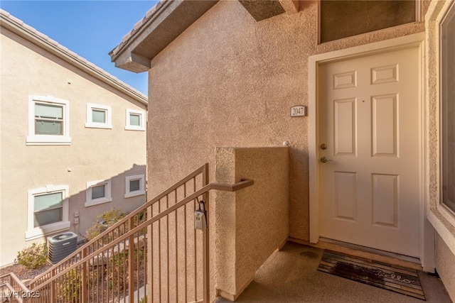 doorway to property with central AC