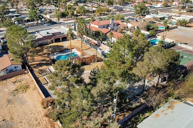 birds eye view of property with a residential view