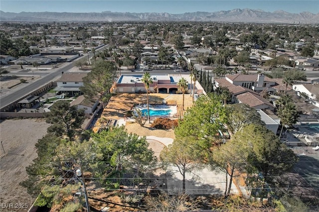 birds eye view of property featuring a mountain view and a residential view