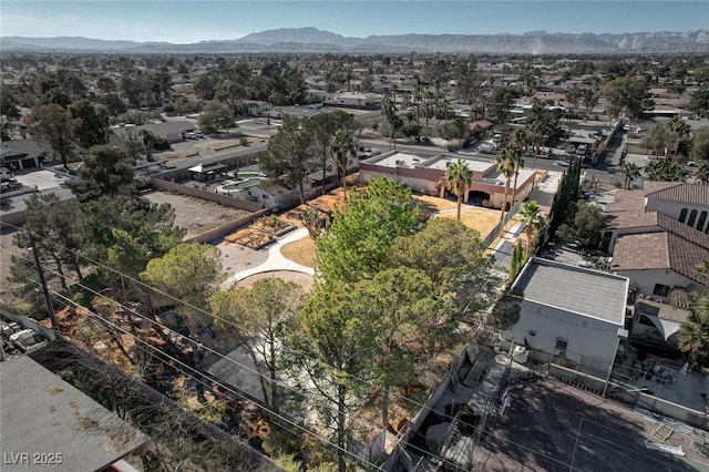 birds eye view of property with a mountain view and a residential view