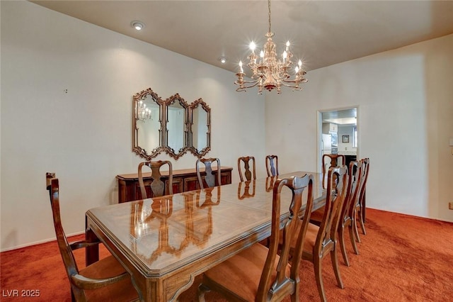 dining space featuring a notable chandelier and carpet floors
