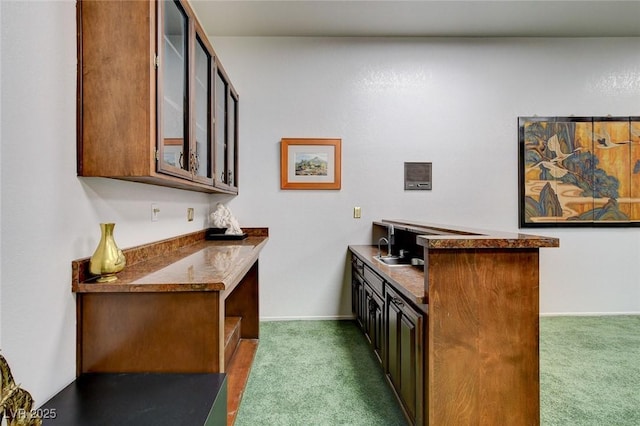 bar featuring bar area, carpet, and baseboards