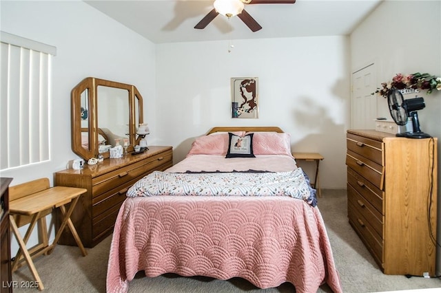 bedroom featuring light carpet and ceiling fan