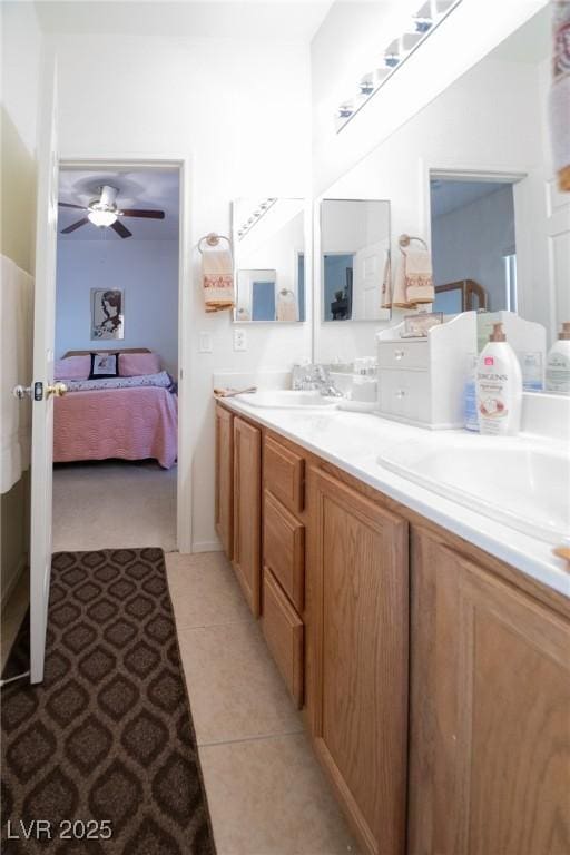 bathroom with ceiling fan, tile patterned floors, and vanity