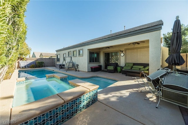 view of pool with an in ground hot tub, ceiling fan, and a patio