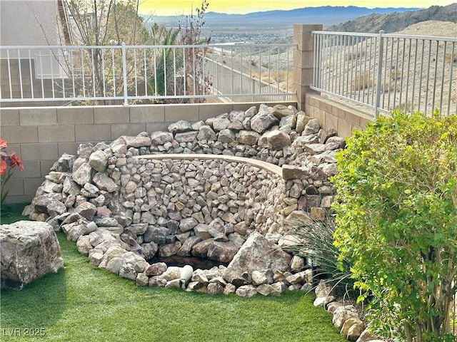 yard at dusk with a mountain view