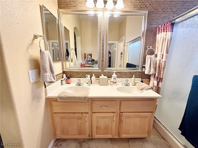 bathroom featuring decorative backsplash, vanity, and a shower with curtain