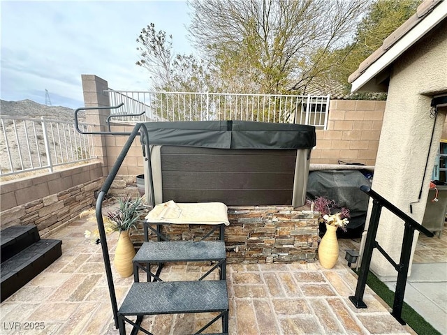 view of patio / terrace featuring a hot tub