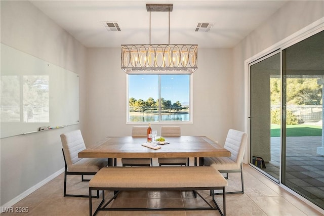 dining room with light tile patterned flooring