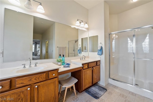 bathroom featuring walk in shower and vanity