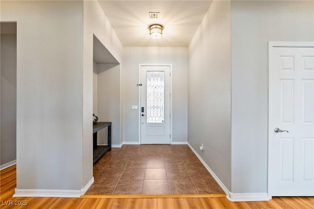 entrance foyer featuring tile patterned flooring