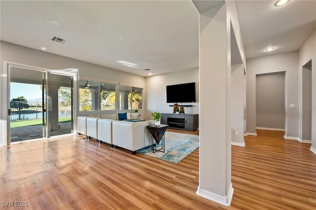 living room with light hardwood / wood-style flooring