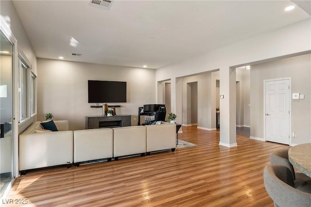 living room with light hardwood / wood-style floors