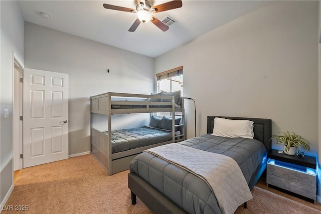 bedroom featuring light carpet and ceiling fan