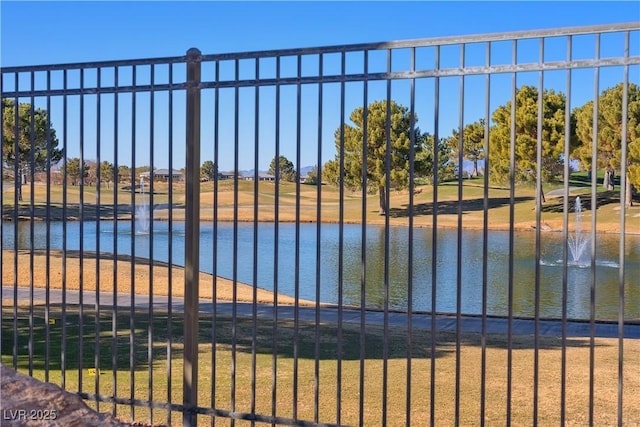 view of gate with a water view