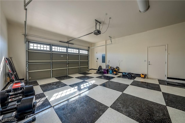 garage with a garage door opener and electric panel