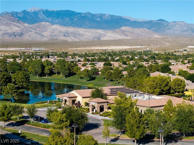 aerial view featuring a water and mountain view