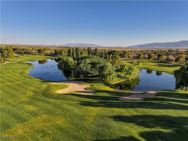 surrounding community featuring a yard and a water and mountain view