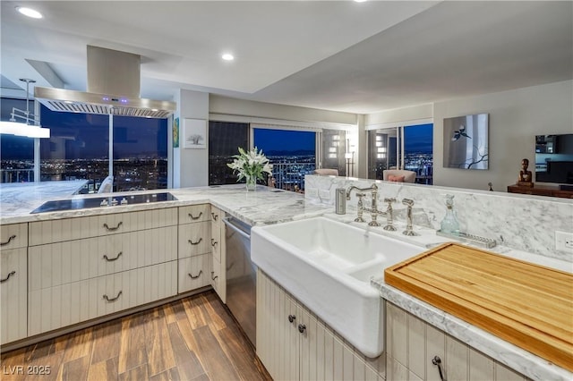 kitchen with stainless steel dishwasher, sink, island exhaust hood, dark hardwood / wood-style floors, and black electric cooktop