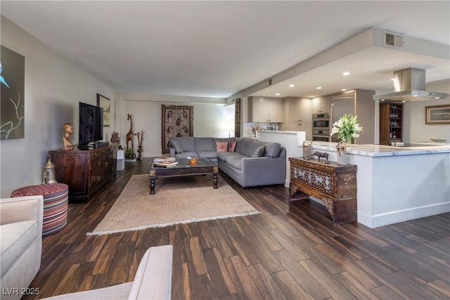 living room with dark hardwood / wood-style flooring