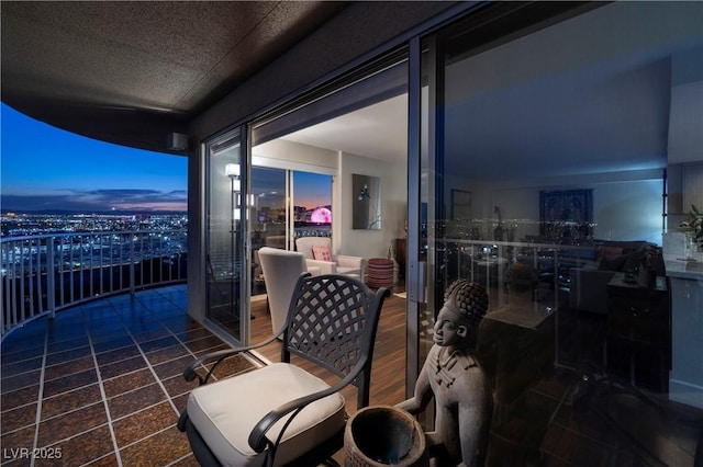 view of balcony at dusk