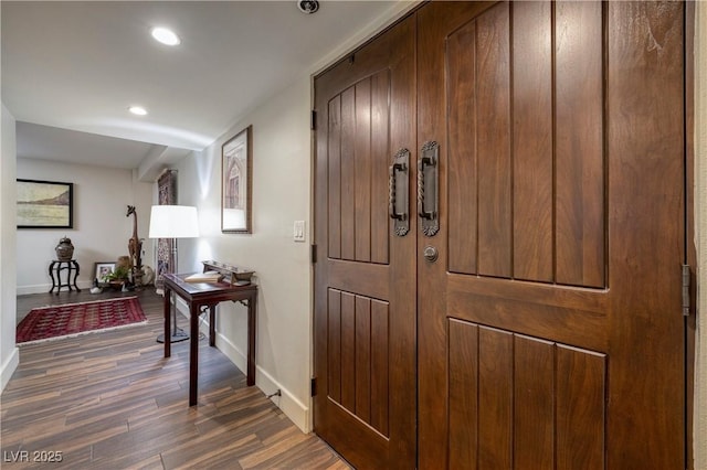 hall with dark hardwood / wood-style floors