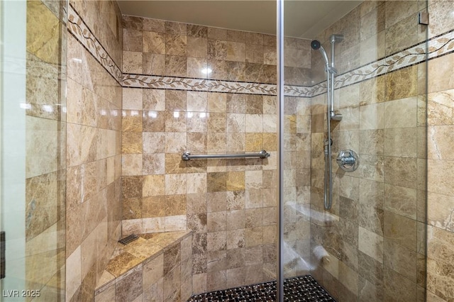 bathroom with a shower with shower door