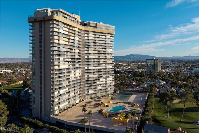 property's view of city with a mountain view