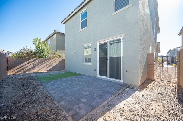 back of house featuring a patio