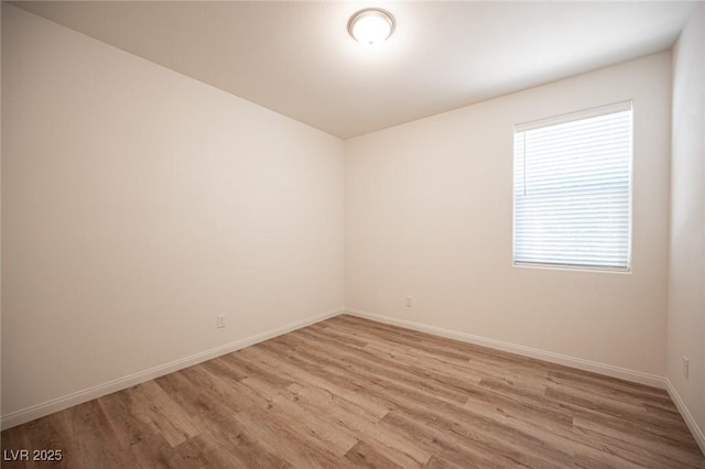 unfurnished room featuring light hardwood / wood-style flooring