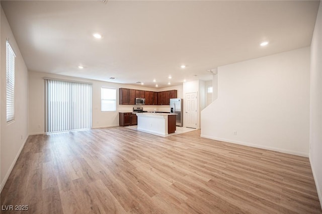 unfurnished living room with light hardwood / wood-style floors