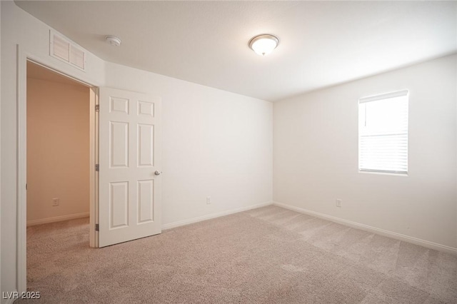 empty room featuring light colored carpet