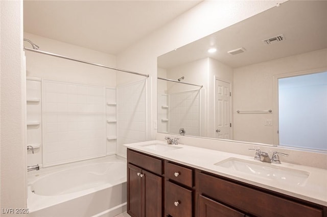 bathroom featuring vanity and shower / washtub combination