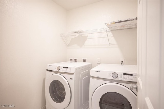 laundry area with washing machine and dryer