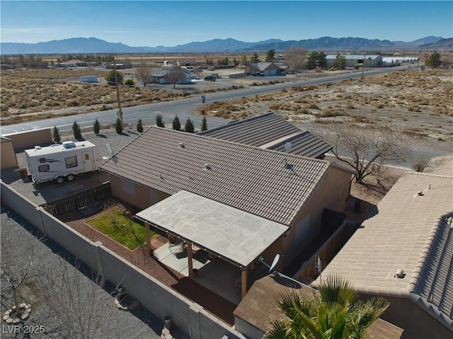 birds eye view of property with a mountain view