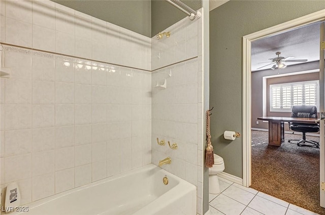 bathroom with shower / tub combination, ceiling fan, tile patterned flooring, and toilet