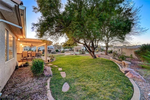 view of yard with a pergola and a patio area